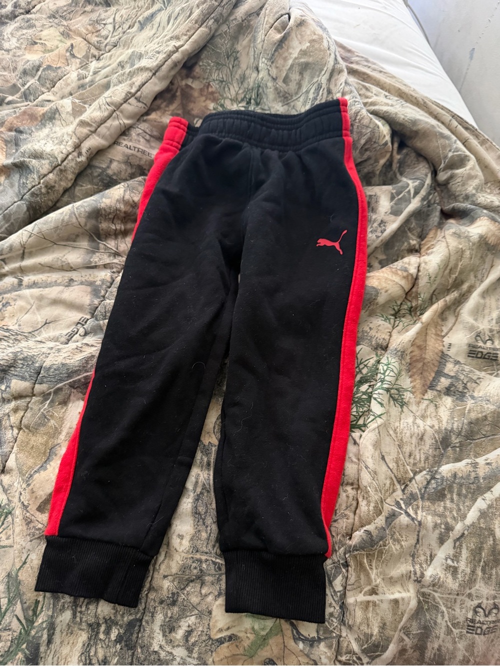 Puma Kids Black Joggers with Red Side Stripes